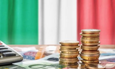 Euro banknotes and coins in front of the national flag of Italy